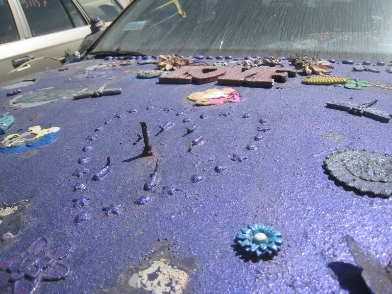 Illustration for article titled Groovalicious Purple Princess Of Peace Art Car Falls On Hard Times, Faces Crusher